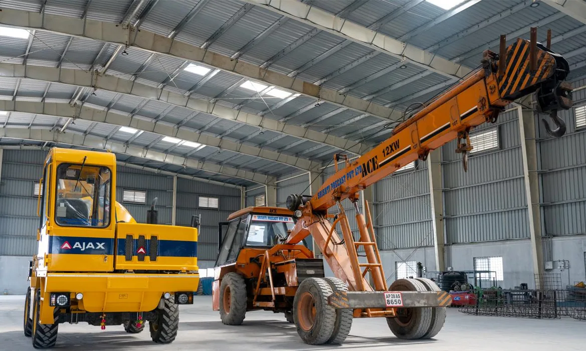 Hydraulic crane and precast production area pictured in the precast company profile